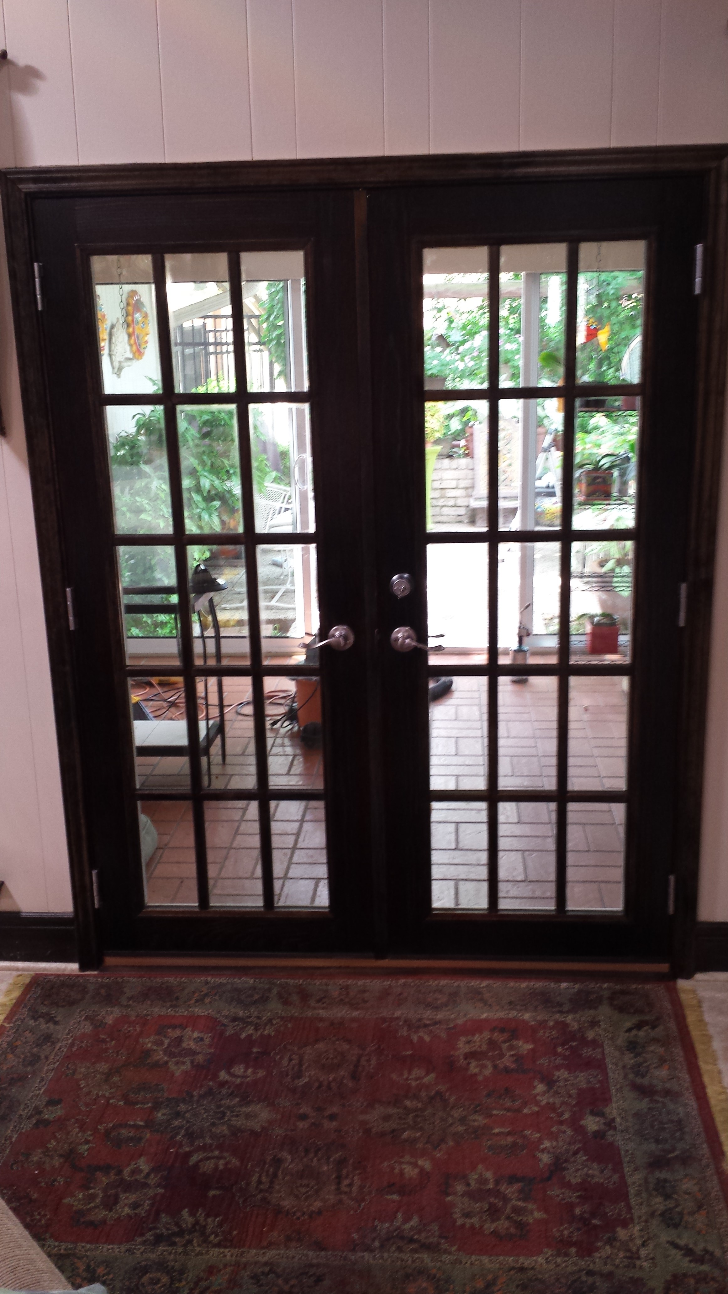 Elegant French patio doors with dark stain finish