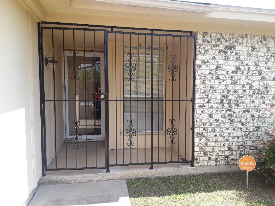 Elegant wrought iron double gate with decorative scrollwork